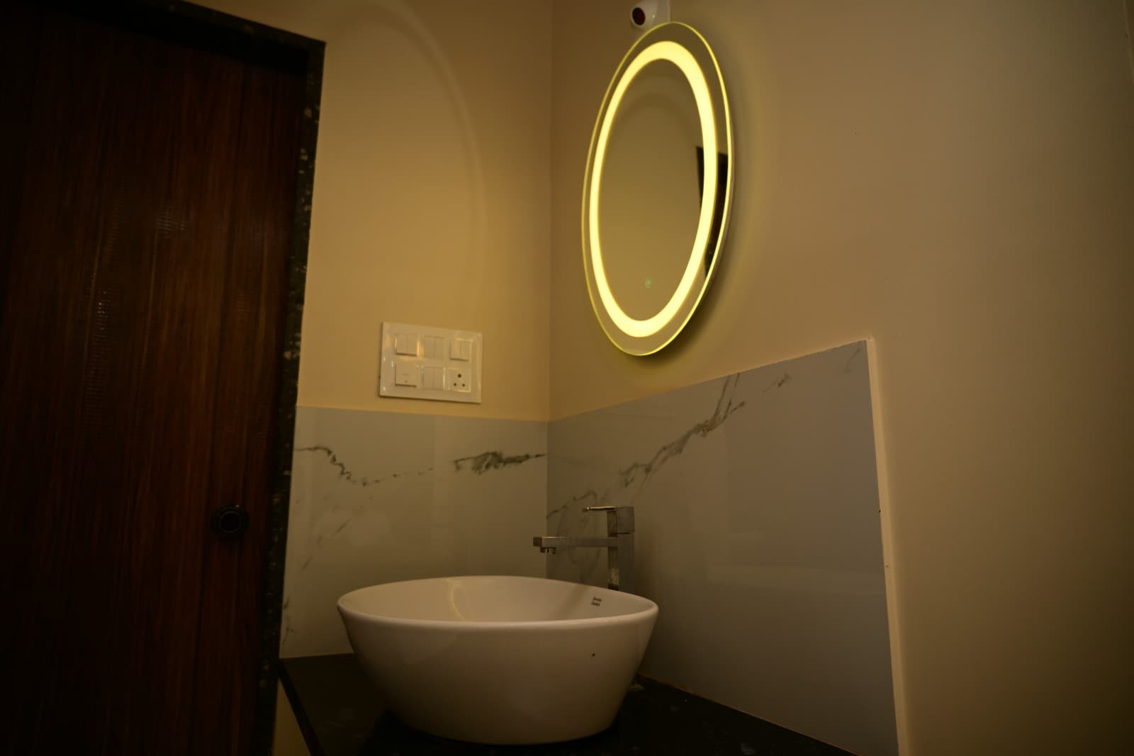 Ensuite dressed in warm tiles and thoughtful lighting.